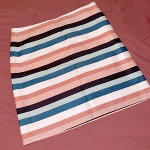 Pink, white and blue striped business casual skirt.